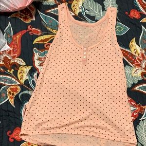 Pink with navy blue polka dots.